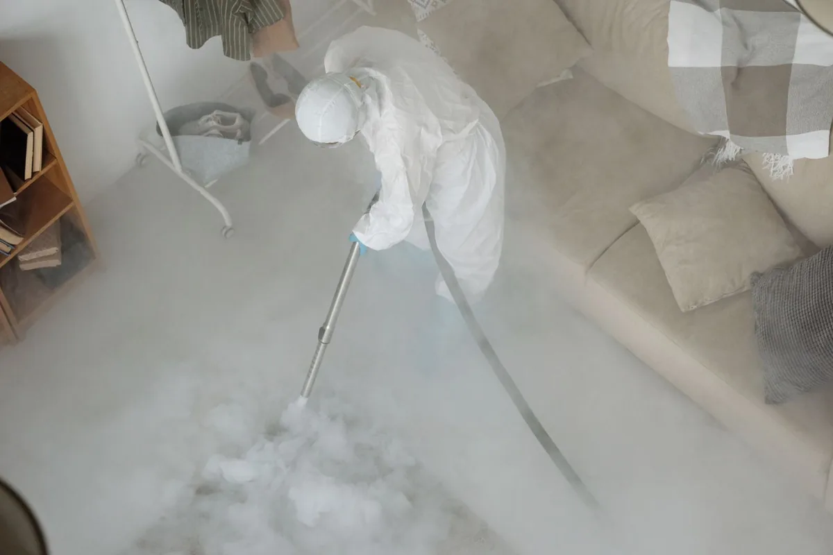 Biohazard cleanup technician in protective equipment, Berkeley, MO